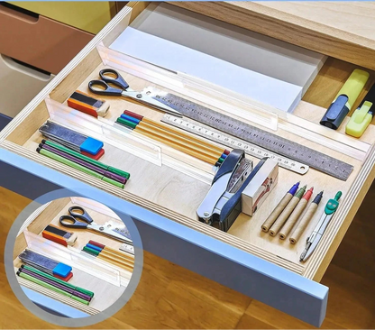tiroir de bureau bien range avec separateurs transparents contenant crayons stylos regles ciseaux et accessoires de bureau